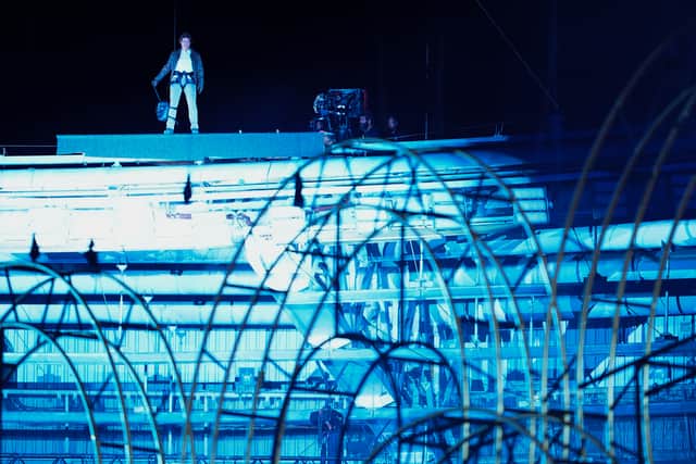 Tom Cruise on the roof before his closing ceremony stunt