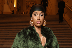 Rapper Cardi B is being sued for throwing a microphone and hitting a fan