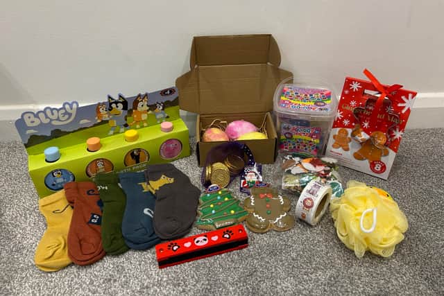 Samantha Mary's presents for one of her children - sticking to a budget of £100. Photo released December 6 2024. A mum who spends just a £100 budget on each child's Christmas present says she is "standing by her own values" despite pressure from others. Samantha Mary, 35, implemented her budget for presents and stocking fillers last Christmas for her two-year-old son Jack and 10-year-old step-daughter, Isabella. After the success of last year, Samantha has decided to do it again - valuing "memories over the money spent." She spends £20 on stocking presents filling them with items including socks, gel pens, and bath bombs and £80 on main presents.
