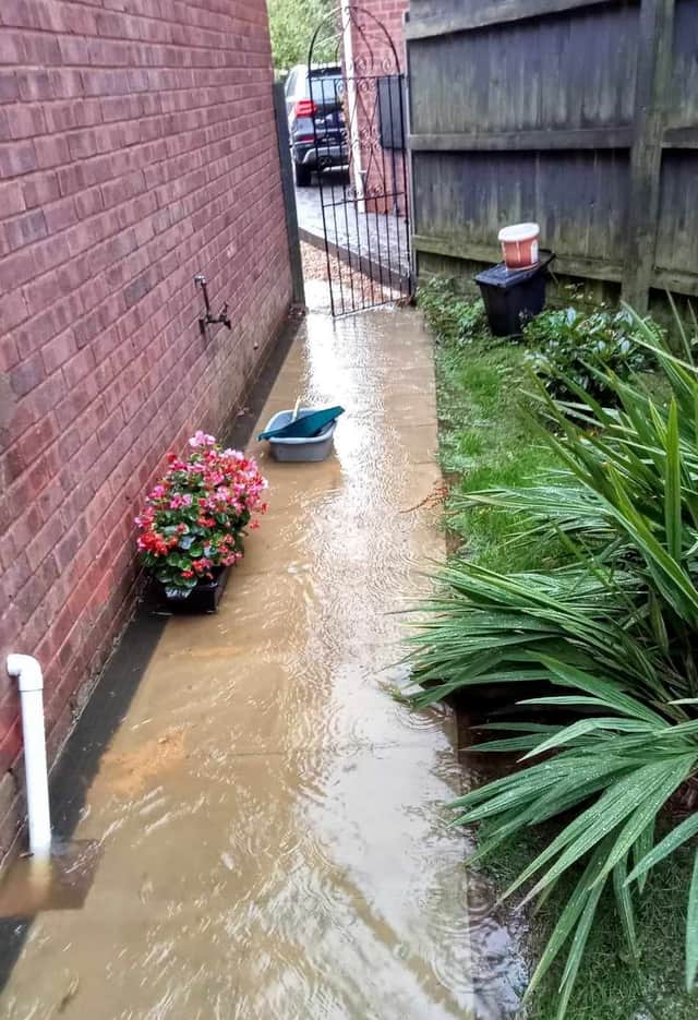 In an attempt to stop the flood and protect the house, Mrs Clarke has even dug ditches and built a DIY dam.