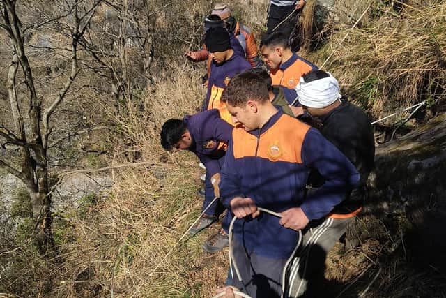 A British tourist has died in northern India after he and another British trekker were rescued from hazardous terrain.
