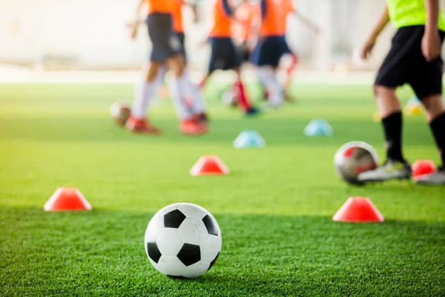 Teenage footballer Adrianno Jeffery, 18, died on his way to hospital after falling ill during training.