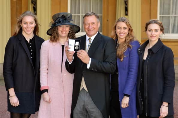 British explorer David Hempleman-Adams (C) poses with his family, (L-R) daughter Amelia, wife Claire, daughter Alicia and daughter Camilla, with his Polar Medal after her was decorated by Prince William, Duke of Cambridge during a ceremony at Buckingham Palace in central London on March 4, 2014. AFP PHOTO / POOL / JOHN STILLWELL (Photo credit should read JOHN STILLWELL/AFP via Getty Images)