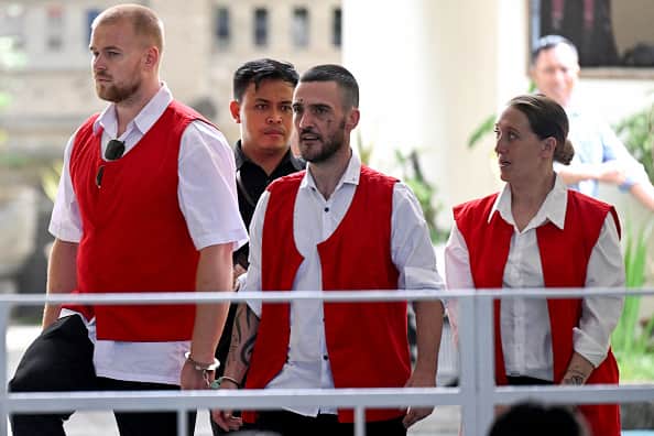 British nationals (L-R) Phineas Ambrose Float, Jonathan Christopher Collyer and Lisa Ellen Stocker are brought to court for their trial in Denpasar, Indonesia's Bali island on June 3, 2025. The trial of three British nationals accused of smuggling cocaine or taking part in a drug deal on Indonesia's popular island of Bali began on June 3, with all facing the death penalty in a nation with some of the world's toughest narcotics laws. (Photo by SONNY TUMBELAKA / AFP) (Photo by SONNY TUMBELAKA/AFP via Getty Images)
