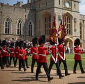 Members of the Coldstream Guards march during a ceremony at Windsor Castle, Berkshire, where King Charles III, Colonel-in-Chief of the Coldstream Guards, presents four new Colours to the 1st and 2nd Battalion (Number 7 Company) of the Coldstream Guards in their 375th year