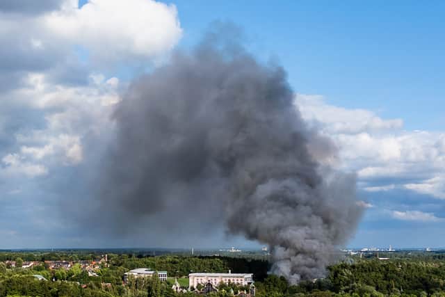 Smoke caused by a fire billows above the site of the Tomorrowland electronic music festival in Boom, northern Belgium on July 16, 2025.