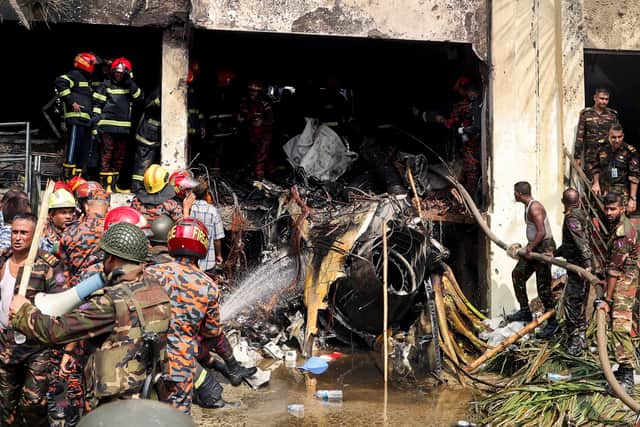 At least 19 people have died and 164 were injured after a F-7 BGI fighter jet crashed into a school in Bangladesh. (Photo: AFP via Getty Images)
