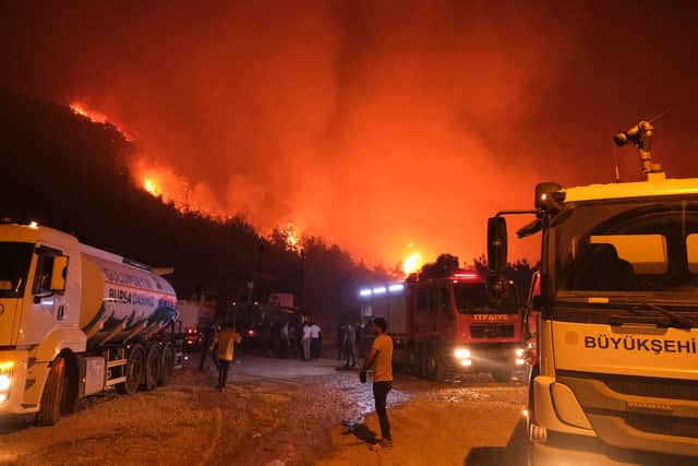 Wildfires are spreading in Turkey forcing evacuations and killing at least 14 people - amid 50C heat. (Photo: AFP via Getty Images)