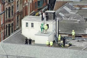 Police have arrested several children after youths climbed onto the former Debenhams building in Nottingham city centre