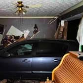 A vehicle ploughed into the front of the house in Flamsteed Road, Strelley, Nottingham at about 1am on Sunday (17 August).
A man has been arrested on suspicion of dangerous driving, drink-driving, criminal damage, and aggravated vehicle taking.
He was additionally arrested on suspicion of driving without a valid licence and driving without the correct insurance.
