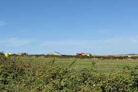Emergency services are responding after a helicopter crashed in a field on the Isle of Wight. (Photo: @southwellstu/X)