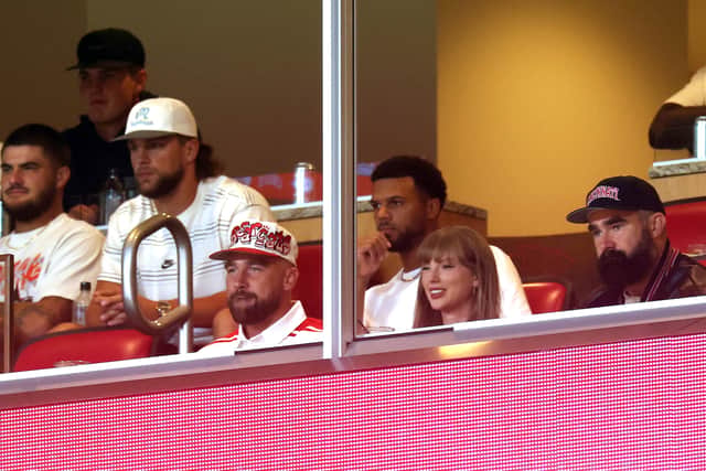 Travis Kelce and Taylor Swift take in a game at Arrowhead Stadium alongside Travis' brother Jason following their engagement announcement.