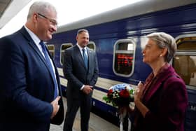 Ukrainian Foreign Minister Andrii Sybiha (left) alongside Head of the Office of the President of Ukraine Andriy Yermak, welcomes Foreign Secretary Yvette Cooper on her arrival at a railway station, in Kyiv, Ukraine.