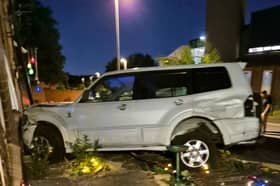 Emma Graves, 44, was left 'terrified' when a car being pursued by police smashed into her flat - just as she was playing Grand Theft Auto