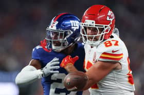 Tyler Nubin of the New York Giants breaks up a pass to Travis Kelce, number 87 of the Kansas City Chiefs, during the first quarter at MetLife Stadium on September 21, 2025 in East Rutherford, New Jersey