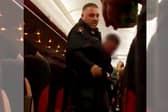 A man has been dragged off an EasyJet flight to Corfu after it was forced to make an unscheduled landing in Milan