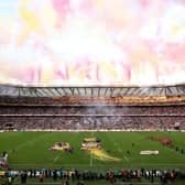 A general view as Zoe Aldcroft of England lifts the Women's Rugby World Cup trophy following the Women's Rugby World Cup 2025 Final match between Canada and England at Allianz Stadium on September 27, 2025 in London, England. 