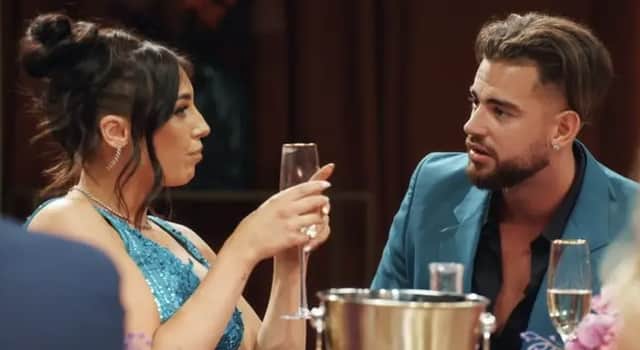 Married at First Sight 2023 bride Erica has shared some behind-the-scenes details about how MAFS dinner parties work. She is pictured at one with her on-screen husband Jordan. Photo by Channel 4.