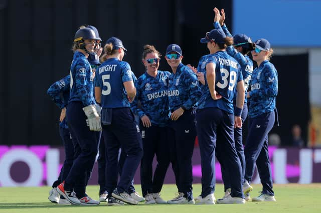 Linsey Smith of England celebrates with team mate Charlie Dean after taking the wicket of Laura Wolvaardt of South Africa (not pictured) during the ICC Women's Cricket World Cup India 2025 match between England and South Africa