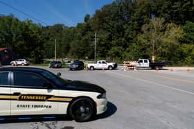 Police and Department of Transportation workers block the road leading to Accurate Energetic Systems 