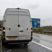 The white van that was pulled over by police after its driver made obscene hand gestures to undercover cops on the M1