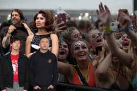 Who are the current favourites to be a headliner at next year's Reading and Leeds Festivals, in the run up to Christmas this year?