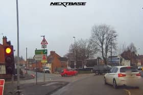 A car runs a temporary red light.