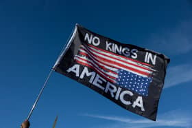 A demonstrator waves a flag during a rally at the Lincoln Memorial 