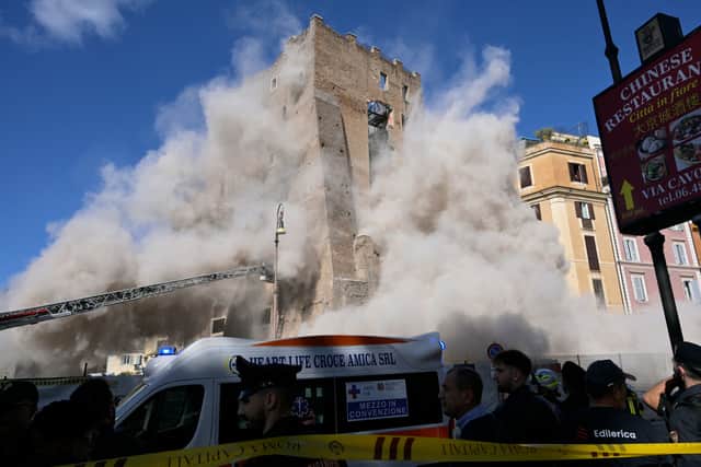 Emergency services rushed to Italy’s capital Rome after the partial collapse of a medieval tower near the Colosseum. (Photo: AFP via Getty Images)