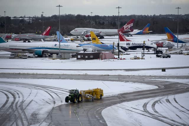 Hundreds of flights are cancelled today at airports across the UK as wintry weather continues. (Photo: AFP via Getty Images)