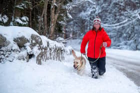 Lorraine Porter walks her dog Missy in Kenethmont Aberdeenshire. Photo by Michael Traill 