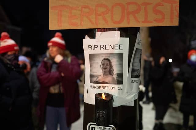 A notice reading "RIP Renee, murdered by ICE" is seen next to a memorial for Renee Nicole Good