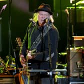 Neil Young has apologised after cancelling his tour
