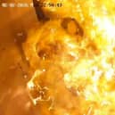 CCTV captured the heartstopping moment a bundle of gas-filled balloons suddenly exploded inside a lift full of people