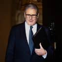 Prime Minister Sir Keir Starmer leaving 10 Downing Street after announcing he is not resigning
