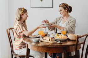 breakfast table mother daughter bread generic 