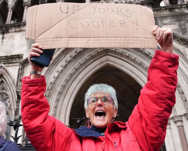 Protesters celebrate outside the High Court, central London, where Dame Victoria Sharp, Mr Justice Swift and Mrs Justice Steyn have ruled in favour of Palestine Action's co-founder Huda Ammori's challenge over the ban of the organisation as a terror group.