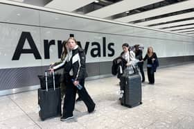 Passengers in the arrivals hall at Heathrow Terminal 5 in London