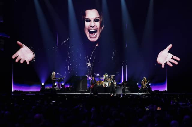 Robbie Williams, centre right performs during the Brit Awards 2026 in Manchester
