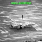 This partially redacted image from video provided by U.S. Central Command shows a military aircraft in Iran shortly before it was struck by a missile fired by U.S. forces
