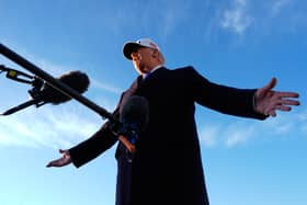 President Donald Trump speaks to reporters before he boards Air Force One