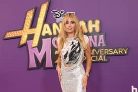 Alex Cooper hosts Disney's Hannah Montana 20th Anniversary Special, is it out, Miley Cyrus’s net worth and age. US singer-songwriter Miley Cyrus attends the world premiere of Disney+'s "Hannah Montana 20th Anniversary Special" at El Capitan theater in Hollywood, California on March 23, 2026. (Photo by VALERIE MACON / AFP via Getty Images)