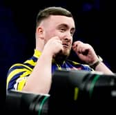 England's Luke Littler reacts during his match against Netherlands' Gian van Veen on night nine of the BetMGM Premier League 2026 at the AO Arena, Manchester