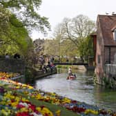 A family take a punt through Westgate Gardens in Canterbury, Kent, during the sunny weather