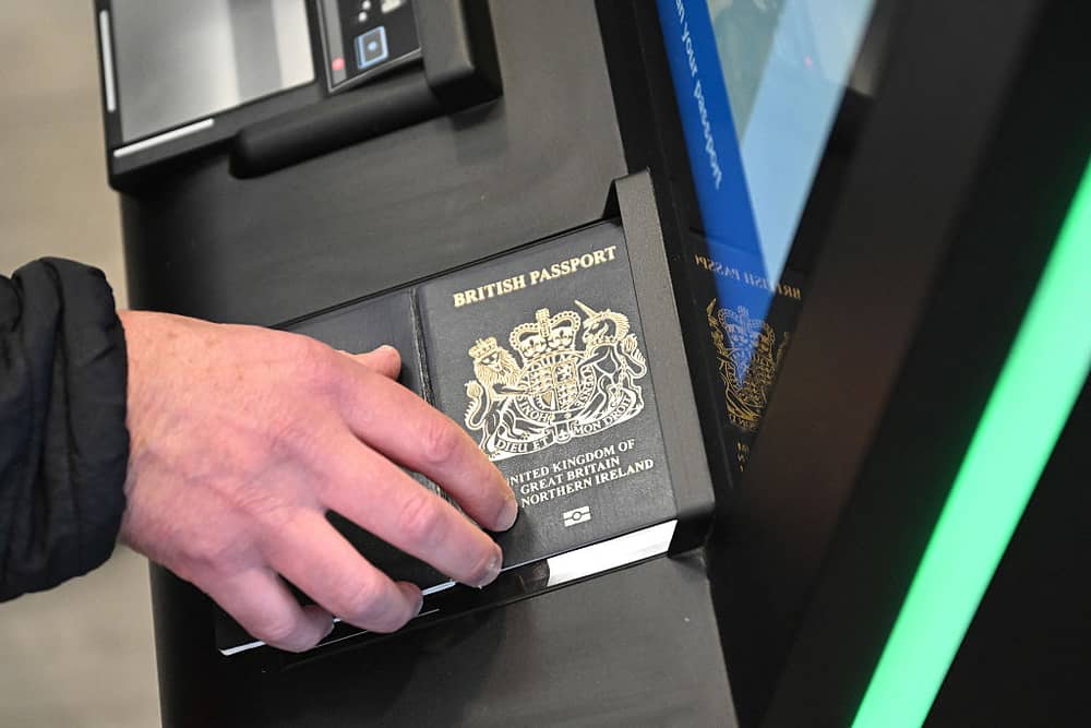 From Portugal to Italy, France and Spain: Reddit users react to delays due to the new Entry/Exit System. A person as their passport scanned whilst using an Automated European Union Entry/Exit System (EES) kiosk during a press preview on the rollout of the EU's new Entry-Exit System (EES) at Eurotunnel, south east England on September 23, 2025. The European Union's new border-check system for non-EU nationals, the so-called Entry/Exit System (EES), which will do away with passport stamps, is set to finally launch October 12. (Photo by Justin TALLIS / AFP) (Photo by JUSTIN TALLIS/AFP via Getty Images)          