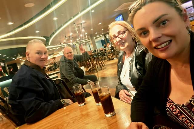 Kelly with her family who were left in 'disbelief' after five holidaymakers had to disembark the plane after it was branded 'too heavy'