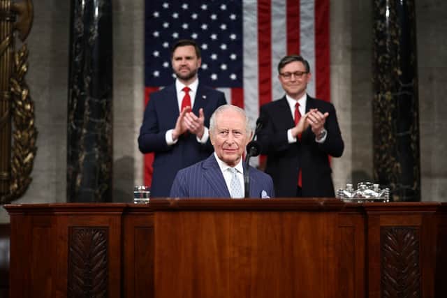 US Vice President JD Vance and House Speaker Mike Johnson applaud as King Charles III arrives to address members of the US House of Representatives and the US Senate during a joint meeting of Congress