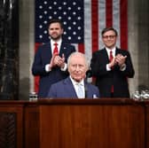 US Vice President JD Vance and House Speaker Mike Johnson applaud as King Charles III arrives to address members of the US House of Representatives and the US Senate during a joint meeting of Congress