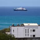 The MV Hondius cruise ship is anchored at a port in Praia, Cape Verde