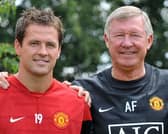 Then Manchester United manager Sir Alex Ferguson (R) with new signing Michael Owen at the Club's Carrington training grounds in Manchester, in 2009